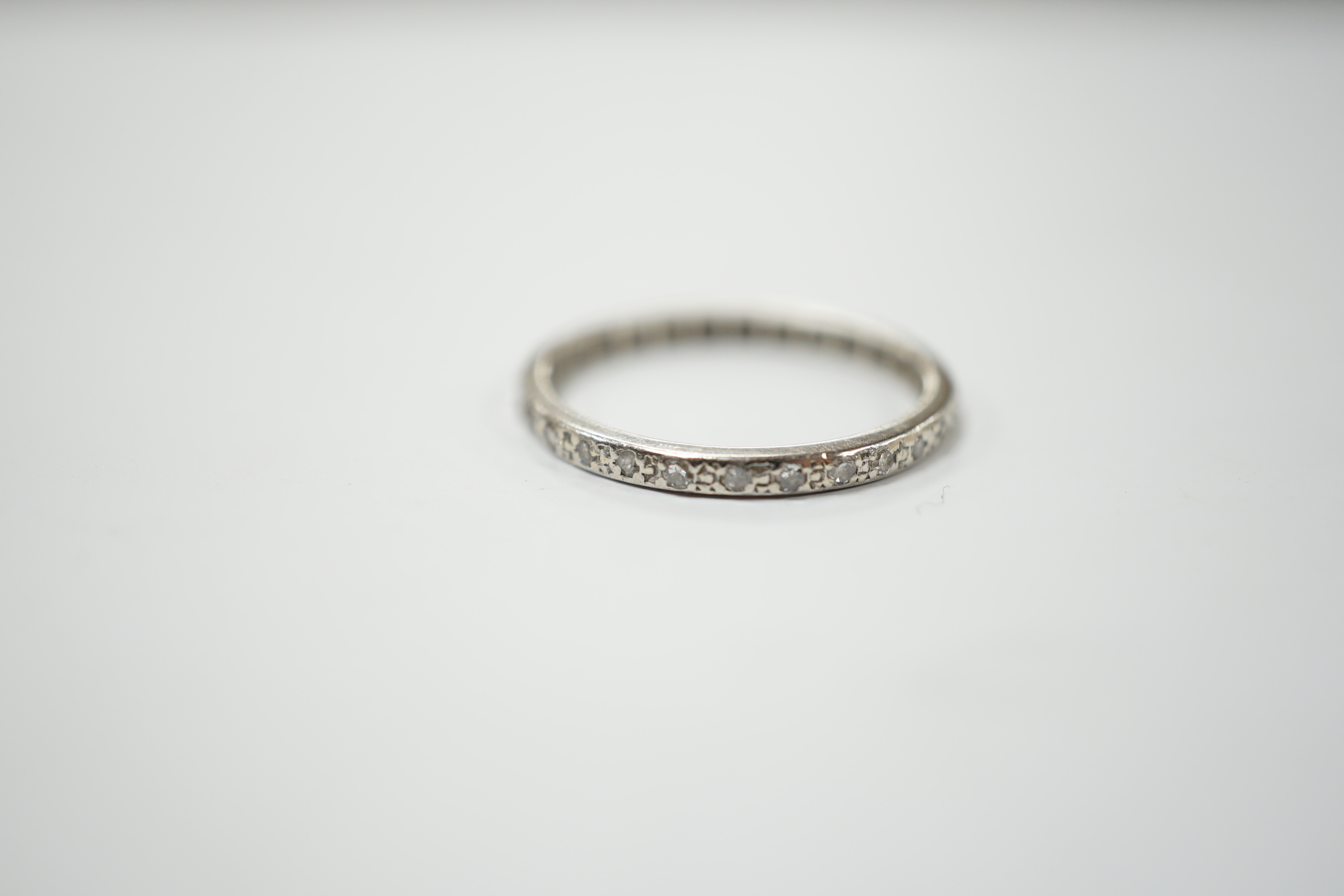 An early 20th century white metal diamond set full eternity ring, size O